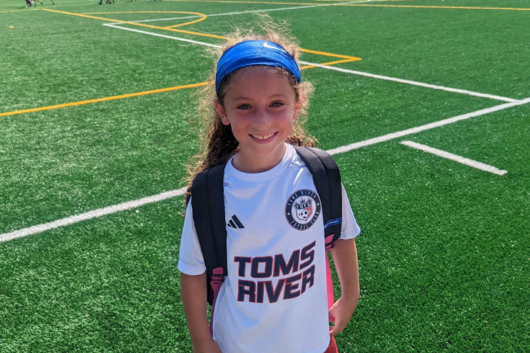 Collette on soccer field