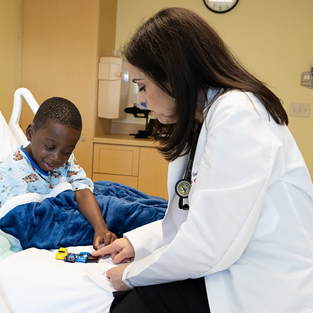 child patient in hospital bed