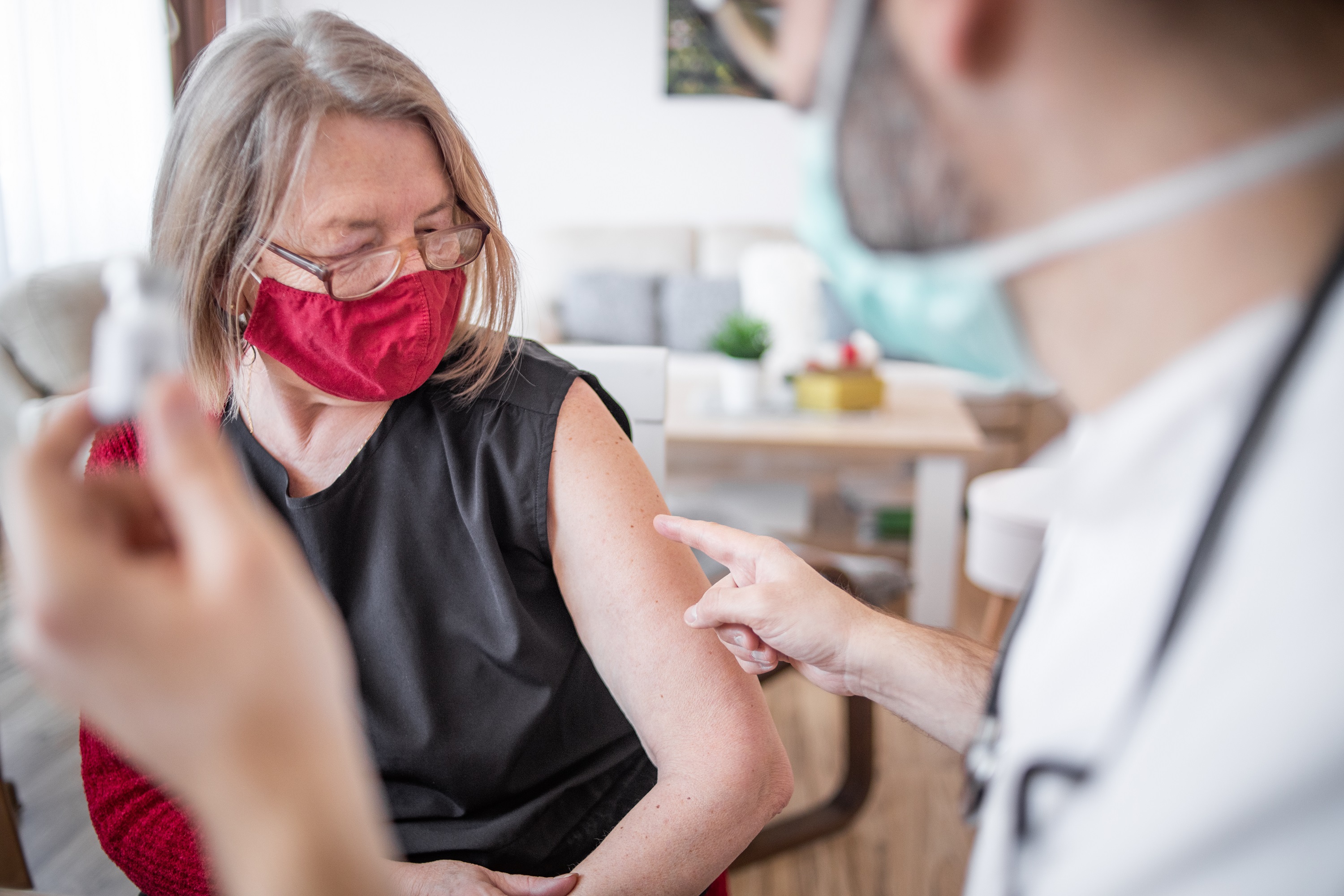 Older woman talking with doctor