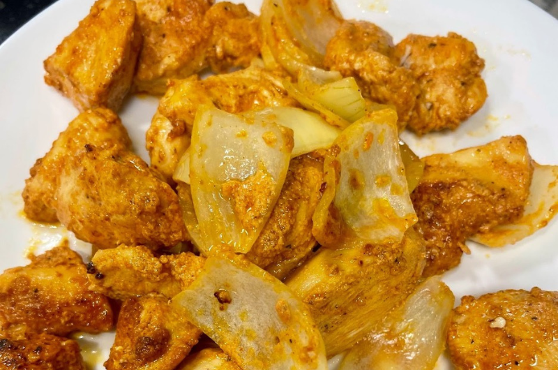 A plate of freshly-cooked, seasoned shish tawook (chicken skewers.)