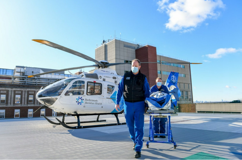 A patient is transported from Hackensack Meridian Health's AirMed One helicopter. 