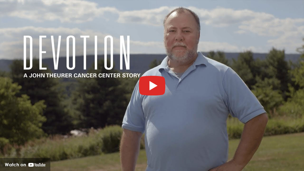 Man standing outdoors for Devotion cancer center story
